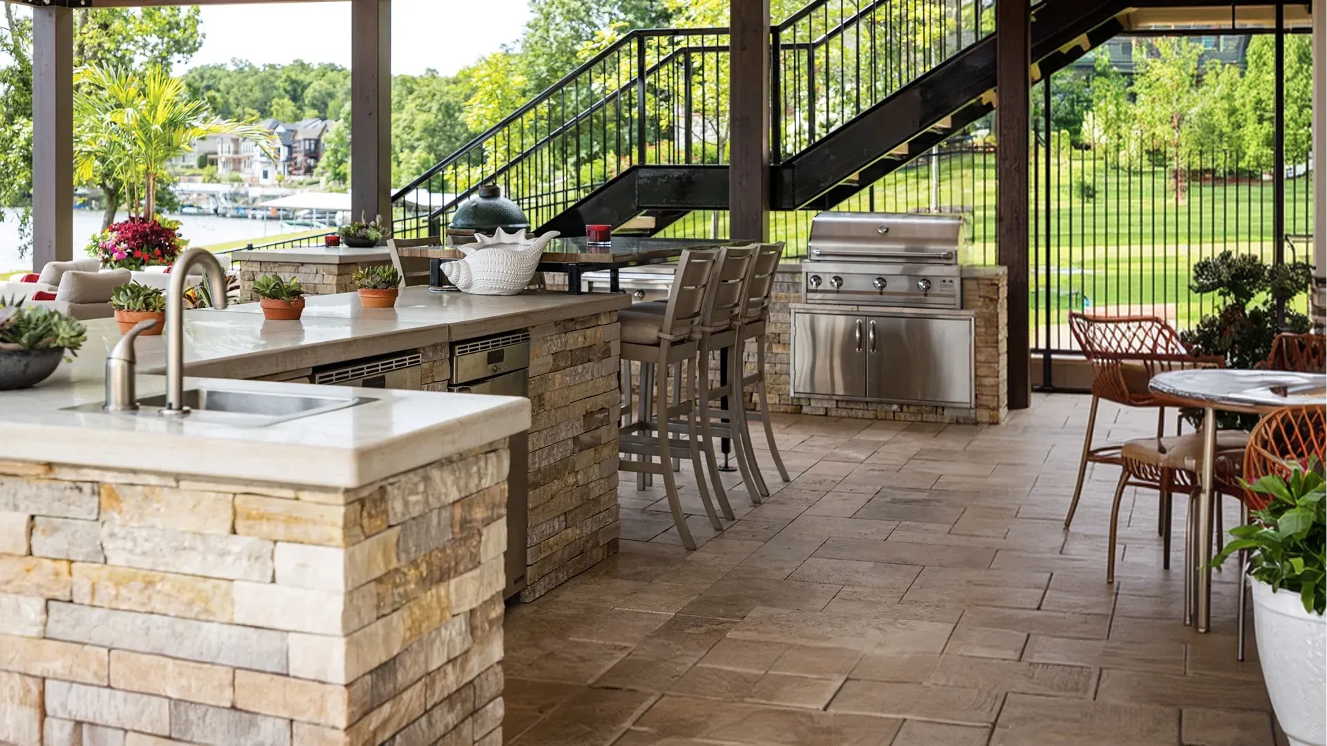 Family enjoying an outdoor kitchen with pavers in Polk County FL.webp Family enjoying an outdoor kitchen with pavers in Polk County FL.webp