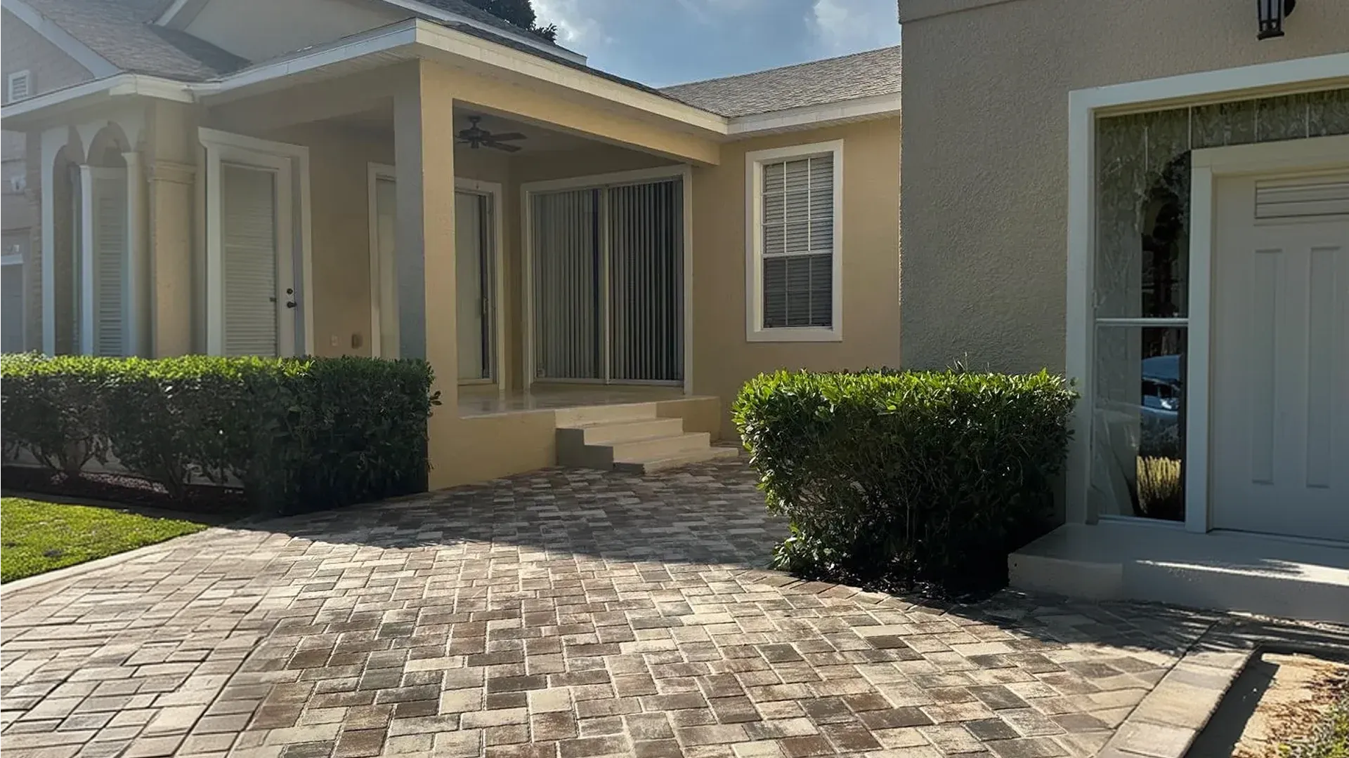 AllBrick Pavers driveway pavers project at a Florida home with landscaped front yard
