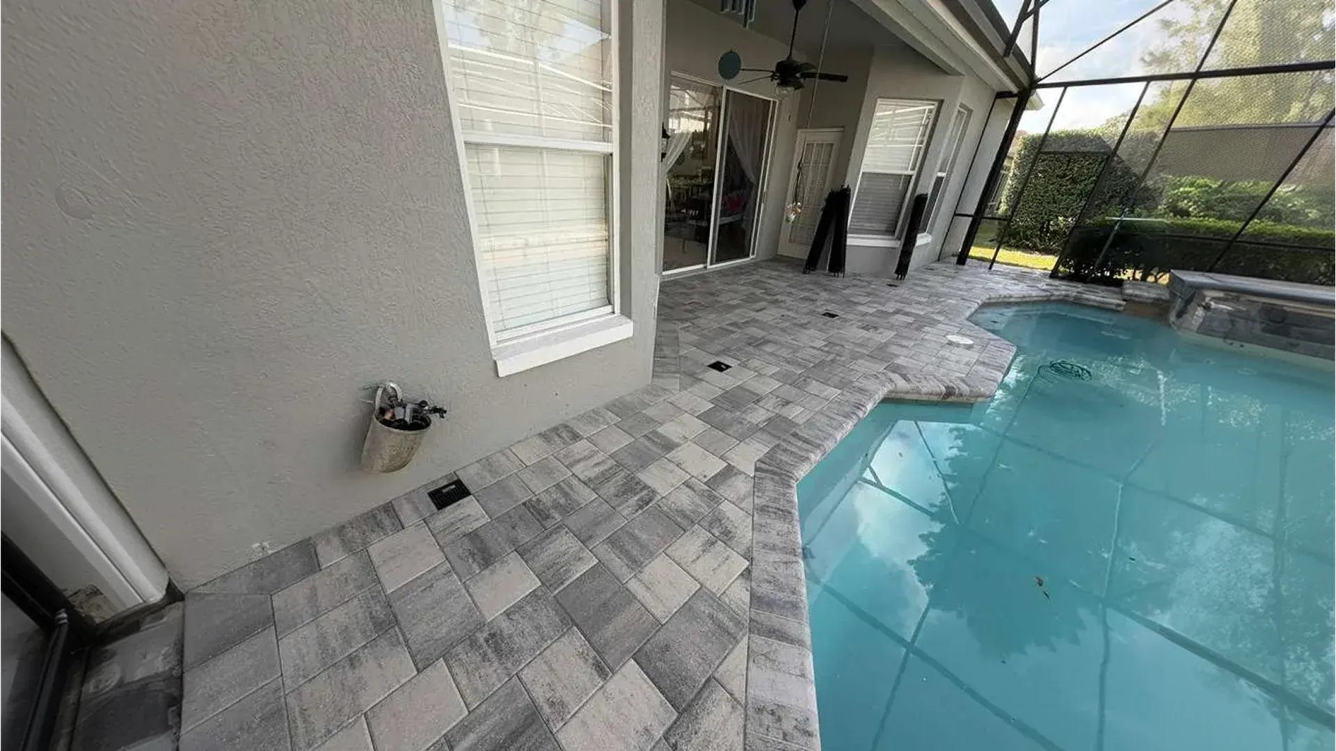 AllBrick Pavers pool deck pavers installation with travertine stones in Central Florid